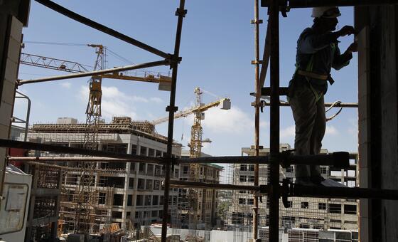 A migrant worker at a construction site in a Gulf nation. The region hosts millions of migrant workers from Asian countries.